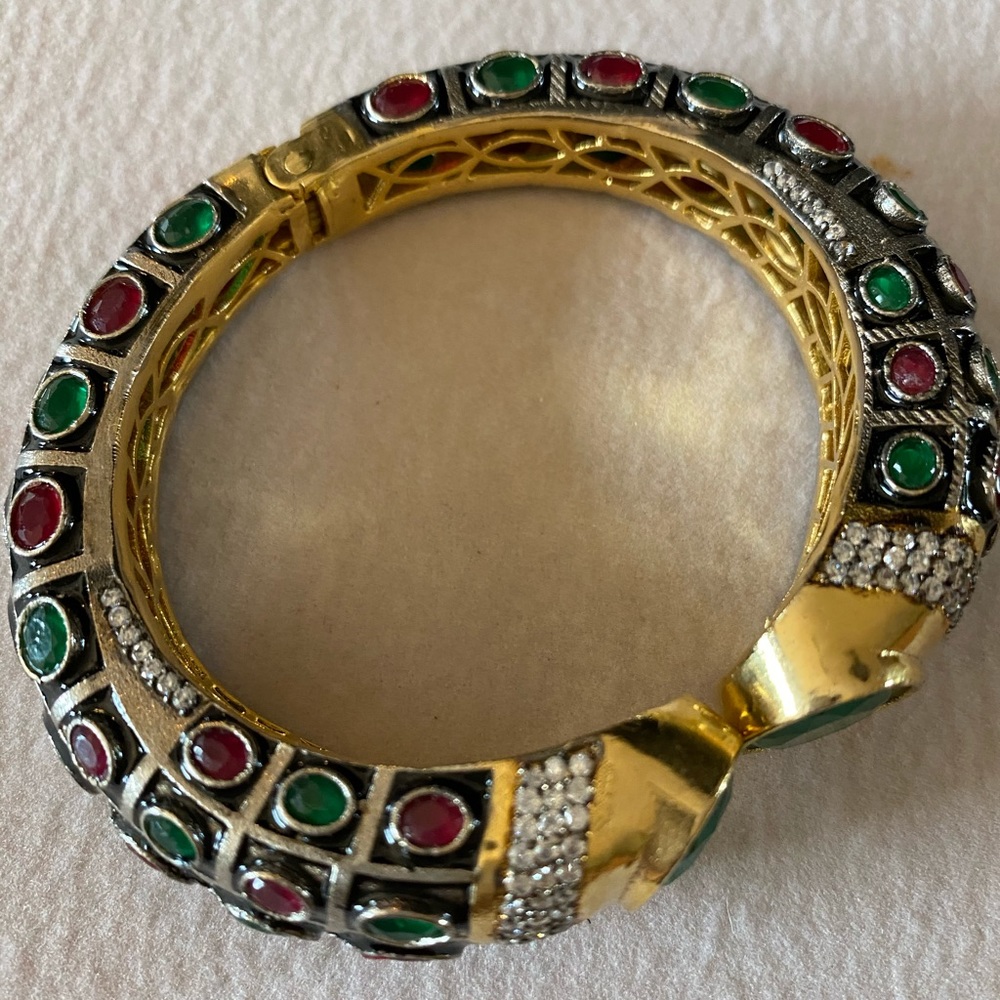 Gold finish with green and red stone Bracelet